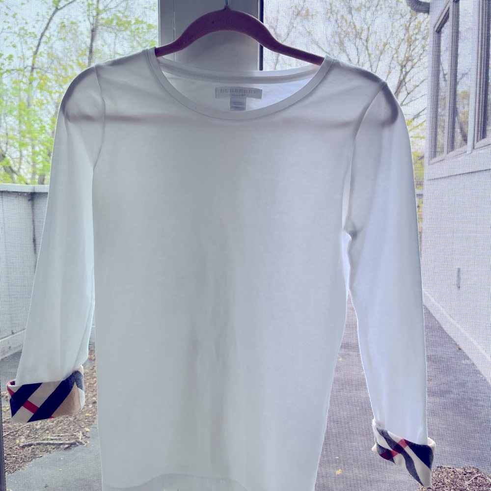 Burberry long sleeve tee for girls. Burberry plaid detail on sleeve cuffs.